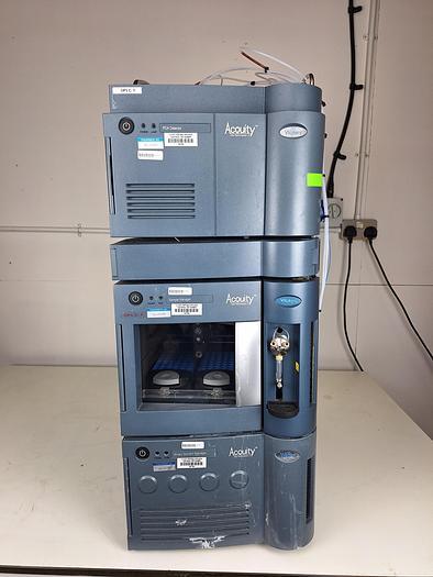Waters ACQUITY UPLC ultra-performance liquid chromatography laboratory system with stacked instrument modules.